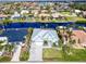 Aerial view of waterfront home with canal access and lush landscaping at 1450 Kiwi Ct, Punta Gorda, FL 33950