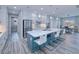 Modern kitchen with a large island, white cabinets, and stainless steel appliances at 1450 Kiwi Ct, Punta Gorda, FL 33950