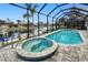 Spa and pool with screened enclosure and water views at 1450 Kiwi Ct, Punta Gorda, FL 33950