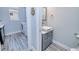 Small bathroom with a modern vanity and walk-in shower at 1450 Kiwi Ct, Punta Gorda, FL 33950