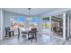 Breakfast nook with sliding doors to the pool area, and a view of the canal at 1450 Kiwi Ct, Punta Gorda, FL 33950