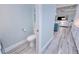 Simple powder room with toilet and light blue walls at 1450 Kiwi Ct, Punta Gorda, FL 33950