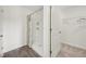 Clean bathroom with shower featuring stylish curtain and organized closet offer functional and appealing amenities at 16307 Alcira Cir, Punta Gorda, FL 33955
