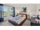 Bright bedroom featuring a leather bedframe, natural light, and stylish decor at 16307 Alcira Cir, Punta Gorda, FL 33955