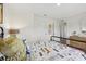 Bedroom featuring an iron bed frame, and playful dog-themed decor at 16307 Alcira Cir, Punta Gorda, FL 33955