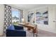 Bright home office with stylish decor, modern desk, and patterned curtains creating a welcoming workspace at 16307 Alcira Cir, Punta Gorda, FL 33955
