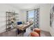 Bright home office with modern decor, a large window, and a stylish desk at 16307 Alcira Cir, Punta Gorda, FL 33955