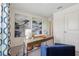 Bright office features modern desk, artwork, and a comfortable chair creating an ideal work-from-home environment at 16307 Alcira Cir, Punta Gorda, FL 33955