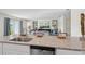 Open-concept kitchen island with granite countertops provides ample space at 16307 Alcira Cir, Punta Gorda, FL 33955