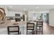 Bright open kitchen with granite counters, stainless appliances and a view of the adjacent dining area at 16307 Alcira Cir, Punta Gorda, FL 33955