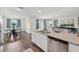 The kitchen island connects the kitchen to the dining area and living room at 16307 Alcira Cir, Punta Gorda, FL 33955