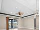 High ceiling living room with fan and access to patio at 17448 Silverspur Dr, Punta Gorda, FL 33982