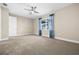 Bright bedroom with ceiling fan, window, and carpet flooring at 17448 Silverspur Dr, Punta Gorda, FL 33982