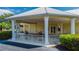 Community clubhouse entrance with covered seating area at 2061 Willow Hammock Cir # 208, Punta Gorda, FL 33983