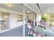 Screened porch with table and chairs, great for relaxing at 2376 Auburn Blvd, Port Charlotte, FL 33948