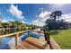 Tranquil canal view from a wooden dock at 2376 Auburn Blvd, Port Charlotte, FL 33948