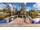 Wooden dock extending over calm water at 2376 Auburn Blvd, Port Charlotte, FL 33948