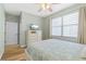 Bedroom with hardwood floors, a flat-screen TV, and white dresser at 268 Lewis Cir # 132, Punta Gorda, FL 33950