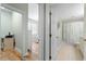 View into bathroom and bedroom with light walls and hardwood flooring at 268 Lewis Cir # 132, Punta Gorda, FL 33950