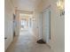 Well-lit hallway with access to unit and elevator at 268 Lewis Cir # 132, Punta Gorda, FL 33950