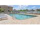 Inviting community pool with lounge chairs and a relaxing atmosphere at 268 Lewis Cir # 132, Punta Gorda, FL 33950