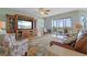 Living Room with access to balcony and comfortable seating at 268 Lewis Cir # 132, Punta Gorda, FL 33950