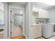 Laundry room with washer, dryer, cabinets, and a utility sink at 268 Lewis Cir # 132, Punta Gorda, FL 33950