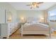 Elegant bedroom featuring a king-size bed and hardwood floors at 268 Lewis Cir # 132, Punta Gorda, FL 33950