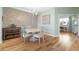 Bright dining area with light wood floors, a round table, and four chairs at 268 Lewis Cir # 132, Punta Gorda, FL 33950