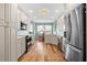 Open concept kitchen with stainless steel appliances and hardwood floors at 268 Lewis Cir # 132, Punta Gorda, FL 33950