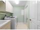 Bright laundry room with washer, dryer, and ample storage at 268 Lewis Cir # 132, Punta Gorda, FL 33950