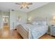 Spacious bedroom with king bed, hardwood floors, and access to bathroom at 268 Lewis Cir # 132, Punta Gorda, FL 33950