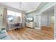 Spacious living room with hardwood floors, a work desk, and French doors at 268 Lewis Cir # 132, Punta Gorda, FL 33950