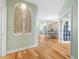 Light and airy entryway showcasing hardwood floors and a view to the dining area at 268 Lewis Cir # 132, Punta Gorda, FL 33950