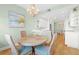 Coastal-themed dining area with a round table and wicker chairs at 268 Lewis Cir # 132, Punta Gorda, FL 33950