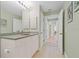 Bathroom with a single sink vanity and access to hallway at 268 Lewis Cir # 132, Punta Gorda, FL 33950