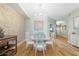 Bright dining area with hardwood floors, a round table, and a chandelier at 268 Lewis Cir # 132, Punta Gorda, FL 33950
