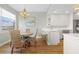Kitchen with light cabinets, breakfast nook, and hardwood floors at 268 Lewis Cir # 132, Punta Gorda, FL 33950