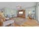 Spacious living room with hardwood floors, comfortable seating, and a large TV at 268 Lewis Cir # 132, Punta Gorda, FL 33950
