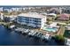 Waterfront condo building with boat docks and a pool at 268 Lewis Cir # 132, Punta Gorda, FL 33950