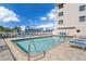 Refreshing community pool with ample lounge chairs for residents at 268 Lewis Cir # 132, Punta Gorda, FL 33950