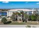 Three-story condo building with palm trees and waterfront view at 268 Lewis Cir # 132, Punta Gorda, FL 33950