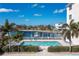 Community pool with lounge chairs and waterfront view at 268 Lewis Cir # 132, Punta Gorda, FL 33950