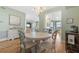 Charming dining room with round table and light-colored chairs at 268 Lewis Cir # 132, Punta Gorda, FL 33950