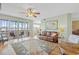 Living room with hardwood floors, access to balcony, and comfortable seating at 268 Lewis Cir # 132, Punta Gorda, FL 33950