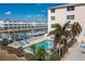 Community pool with lounge chairs and waterfront views at 268 Lewis Cir # 132, Punta Gorda, FL 33950