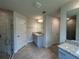 Bright bathroom featuring a glass shower, granite countertops, and tile floors at 27462 Pasto Dr, Punta Gorda, FL 33983