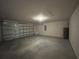 Garage featuring an automatic door and plenty of space for storage at 27462 Pasto Dr, Punta Gorda, FL 33983