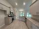 Modern kitchen featuring granite countertops, stainless steel appliances, and stylish cabinets at 27462 Pasto Dr, Punta Gorda, FL 33983