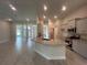 Open kitchen with granite island, stainless appliances, and tile flooring at 27462 Pasto Dr, Punta Gorda, FL 33983